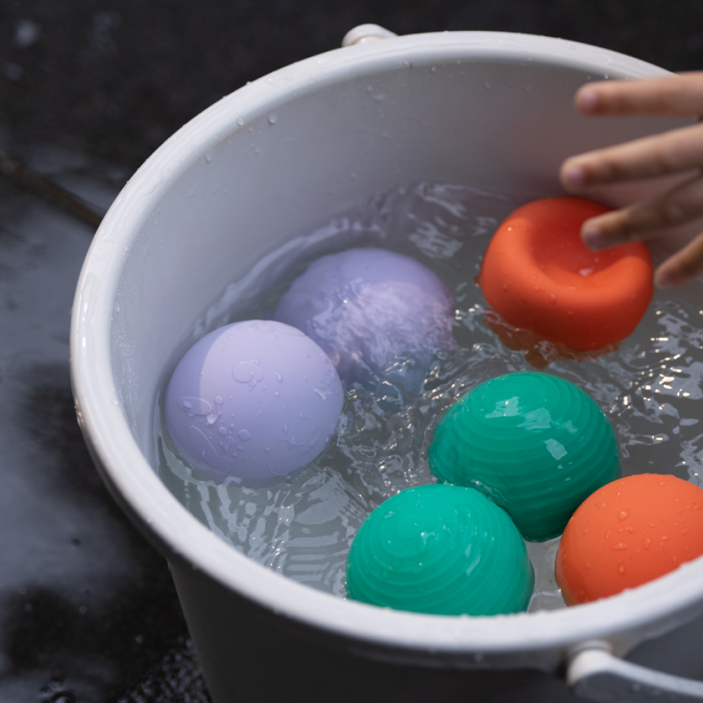 B is for Ball toy in a bucket of water for interactive play