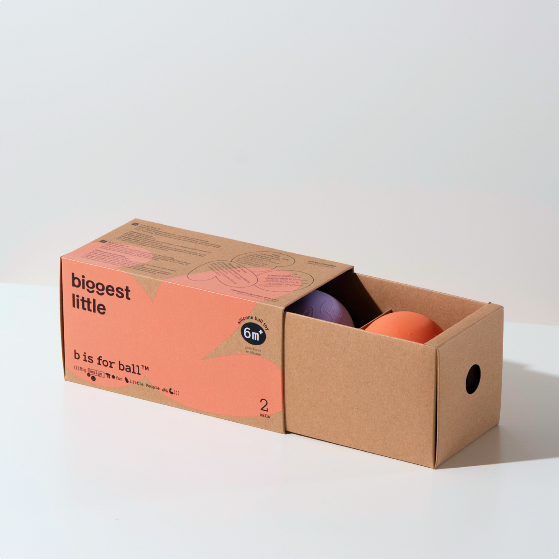 B is for Ball in orange and purple in a simple drawer box