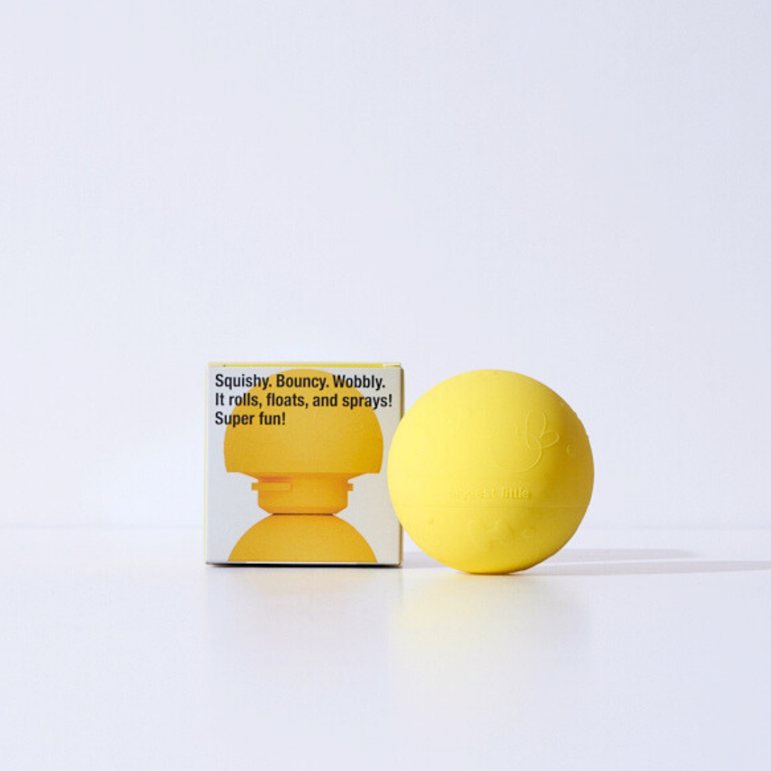 Yellow sensory baby ball with packaging on a white background